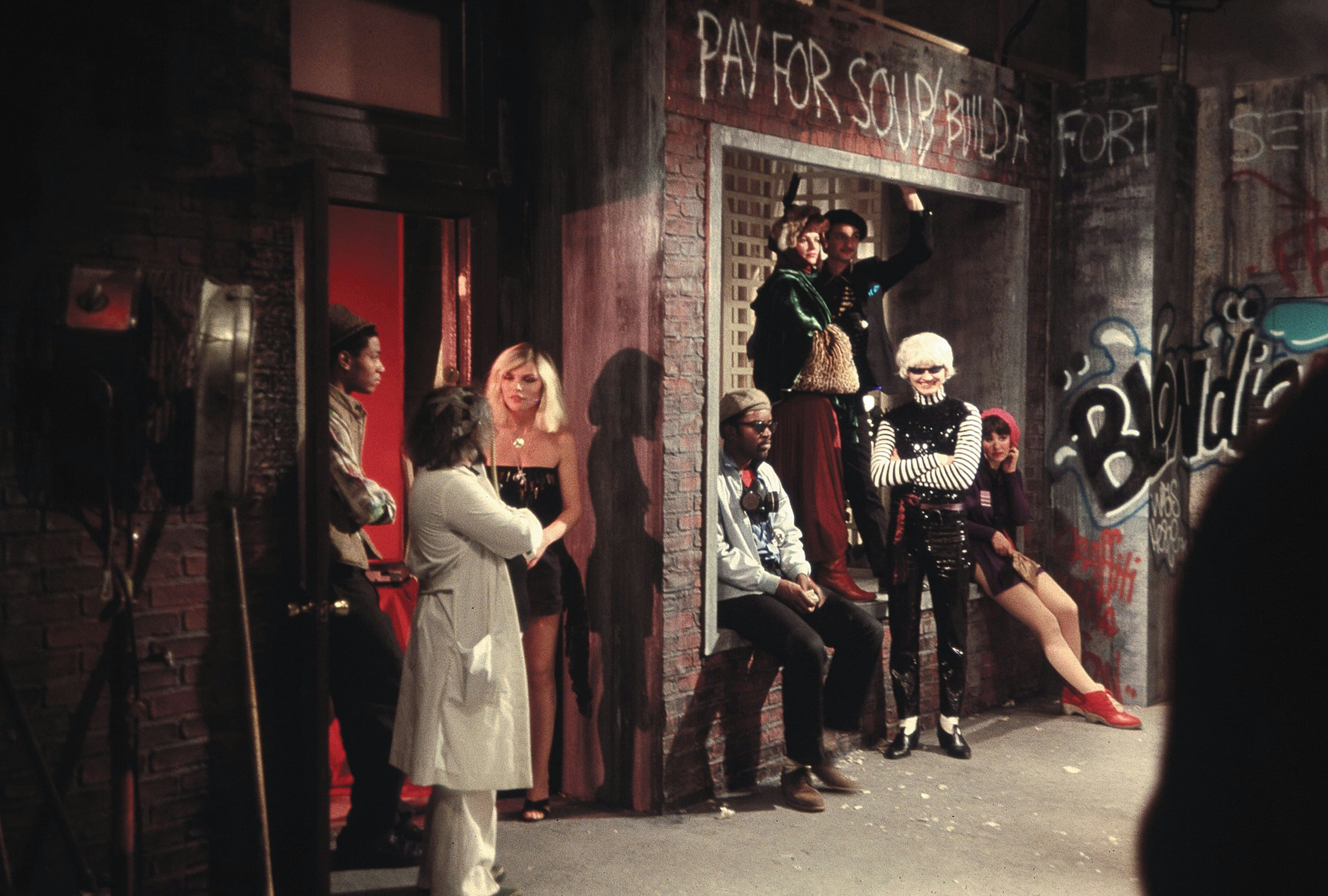 Jean-Michel Basquiat, Debbie Harry, Fab 5 Freddy, and Lenny Ferraro on the set of Blondie's "Rapture" video in 1951. Photo by Charlie Ahearn.